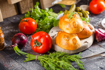 pies, loaf bread, dough on a wooden vintage cutting board old rustic, mustard sauce-dish, tomato,...