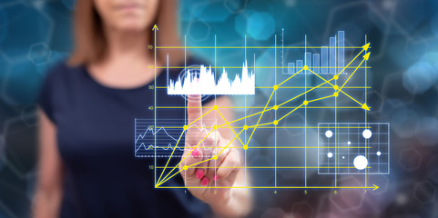 Woman touching business charts