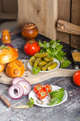 pies, loaf bread, dough on a wooden vintage cutting board old rustic, mustard sauce-dish, tomato,...
