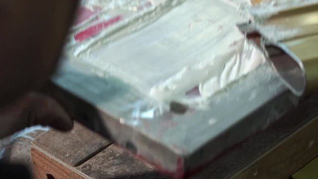 Typography Worker Paints A Small Panel With A Silkscreen