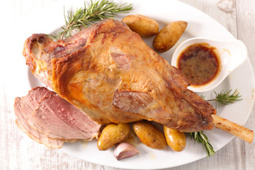 baked lamb leg with potato and sauce