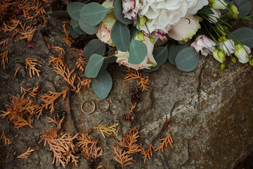wedding rings on a background of flowers