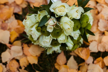 wedding rings on a background of flowers