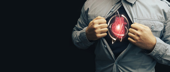Business man in shirt with a picture neon red heart and atom. Innovative technologies.