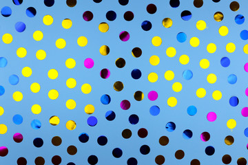 Round confetti on blue background. Festive design. There is a place for text.