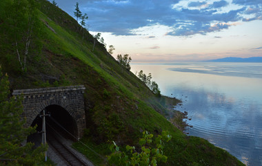 Tunnel on the Old railroad around Lake Baikal. At Sunset