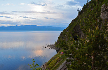 Fototapeta na wymiar Tunnel on the Old railroad around Lake Baikal. At Sunset