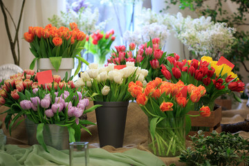 Fototapeta na wymiar Bouquets of tulips on the counter of a flower shop.