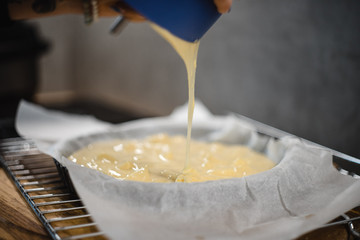 process of making and baking cake in oven at the modern kitchen