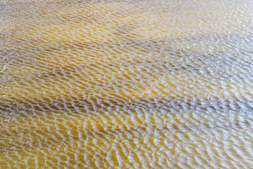 Background texture view of waterflow through pond.