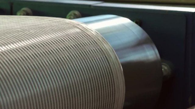 Close-up Of An Industrial Dryer Conveyor Is Spinning In A Print Shop