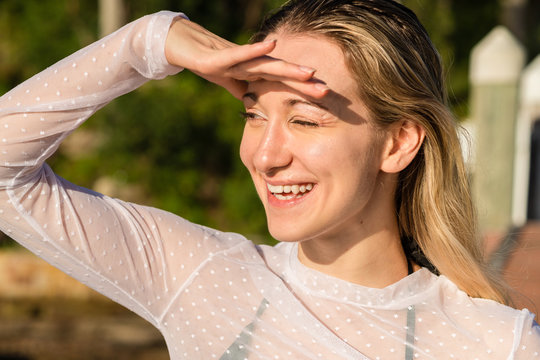 woman squinting in bright sunlight