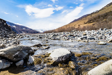 Mountain river in Georgia. A river with a fast current and mountains in the background. Landscapes Of Georgia. 