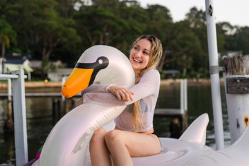 woman with large inflatable swan © gillianvann