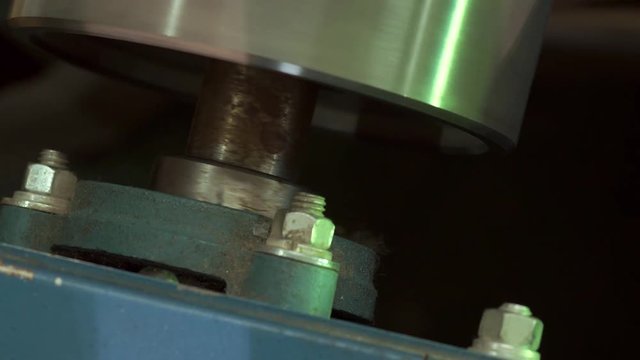 Close-up Of An Industrial Dryer Conveyor Is Spinning In A Print Shop