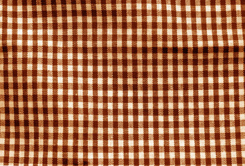 Checked fabric texture in orange tone.