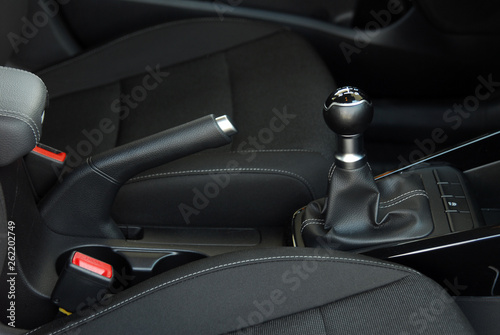 manual gear shift and handbrake inside the passenger car