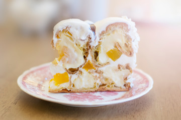 Delicious dessert cake from profiteroles close up.