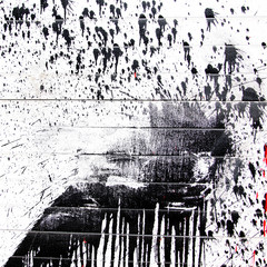 Black paint splashes on white