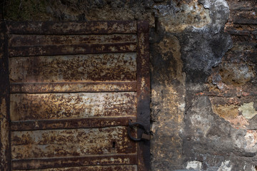 rusty door and weathered wall in an abandoned workshop, Istanbul, Turkey