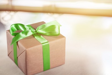 Gift box with green ribbon isolated