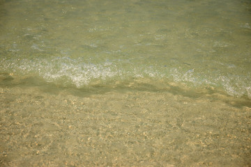 Small waves lapped the beach