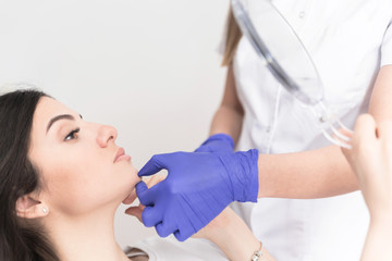 Doctor checking patient chin