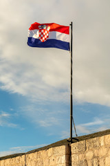 Croatia flag with blue sky and white clouds