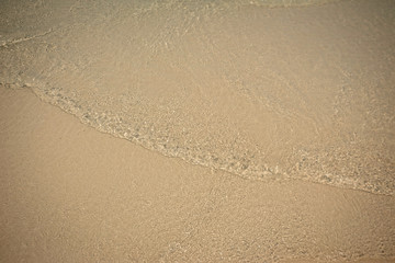 Small waves lapped the beach