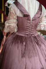 Retro style royal medieval ball - Majestic palace with gorgeous people dressed in king and queen's friends dresses with accessories such as fan and hand puch as a handbag - 2019 © dissx