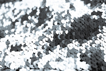background of silver sequins. shiny sparkling background