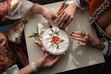 Retro style royal medieval ball - Majestic palace with gorgeous people dressed in king and queen's friends dresses with accessories such as fan and hand puch as a handbag - 2019 © dissx