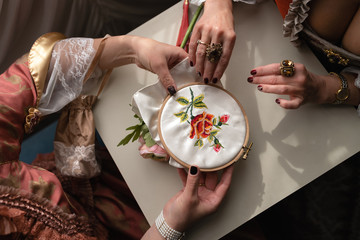 Retro style royal medieval ball - Majestic palace with gorgeous people dressed in king and queen's friends dresses with accessories such as fan and hand puch as a handbag - 2019 © dissx