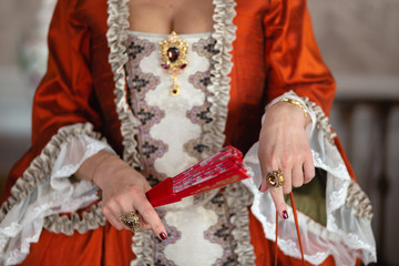 Retro style royal medieval ball - Majestic palace with gorgeous people dressed in king and queen's friends dresses with accessories such as fan and hand puch as a handbag - 2019 © dissx