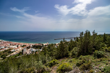 Fototapeta na wymiar aerial view of Sesimbra village with blue sky in background, Portugal