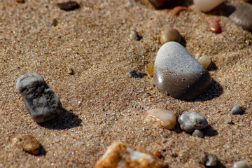 Fototapeta na wymiar pebbles on the beach sand