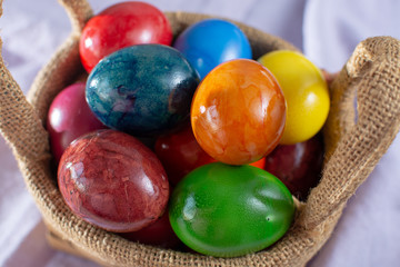 Cooked chicken eggs for Ester celebration dinner, colorful painted with organic paint ready to eat