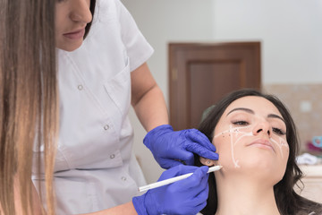 Woman getting ready for aesthetic treatment