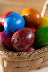 Cooked chicken eggs for Ester celebration dinner, colorful painted with organic paint ready to eat