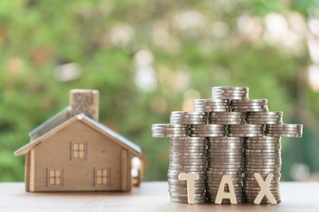 Set money Coin, shaped like a house ,house model, and tax text. With green background, financial...
