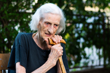 Portrait of a senior woman with a walking cane