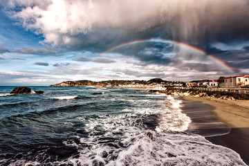 Ischia island with rainbow