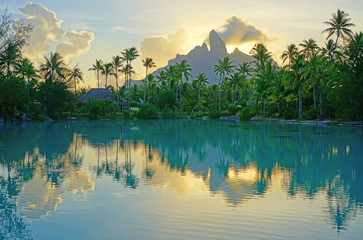View of the Mont Otemanu mountain reflecting in water at sunset in Bora Bora, French Polynesia, South Pacific - obrazy, fototapety, plakaty