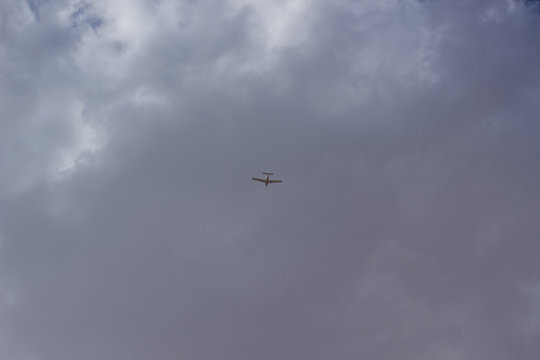 plane air transport from below on cloudy sky background wallpaper pattern concept picture with empty copy space for text
