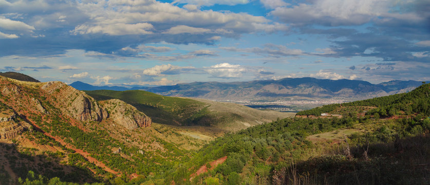 Autumn evening. Panoramic view of mountain valley on the background of the dramatic sky. Nature and travel. Albania, Korcha County, near Moscopole (Voskopoje)