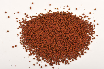 Instant coffee grains isolated on white background and texture