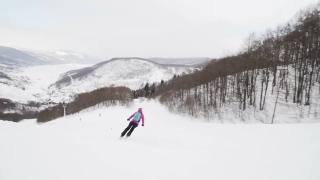 girl skiing on slopes in ski center Mavrovo in Macedonia