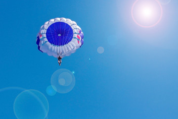 Flying in a balloon against the blue sky. Background with sunlight