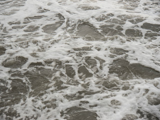 Sea water with storm foam top view