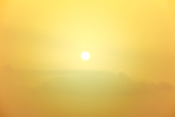 Blur background of flare light in the morning, Light yellow of sunrise in winter, Warm background of sun shine